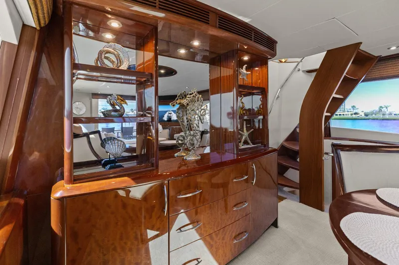 Yacht Photos Pics Luxurious interior of 2005 Lazzara 68 Pilothouse Motoryacht with elegant wood cabinetry and decor.