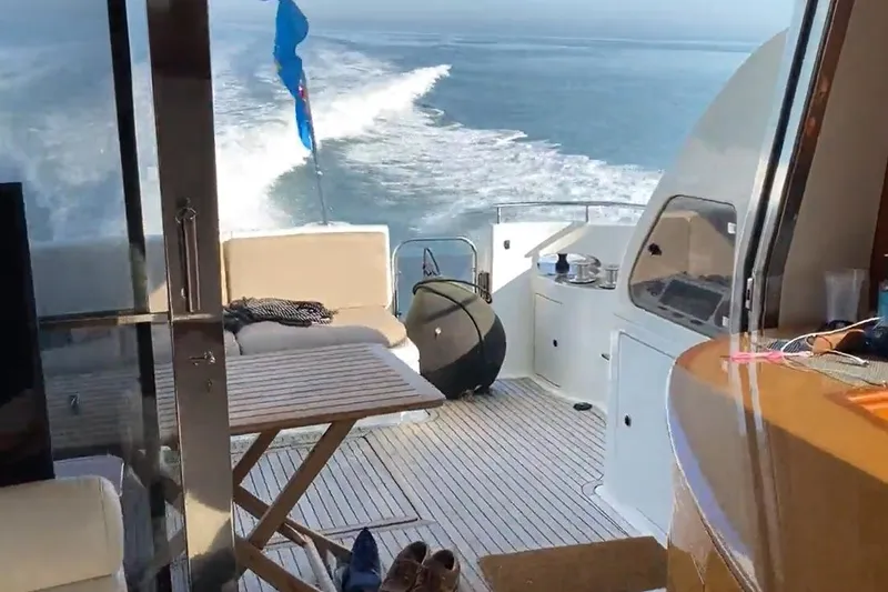 Bianca Lucida Yacht Photos Pics Interior view of 1999 Azimut 58 yacht cruising on open water.