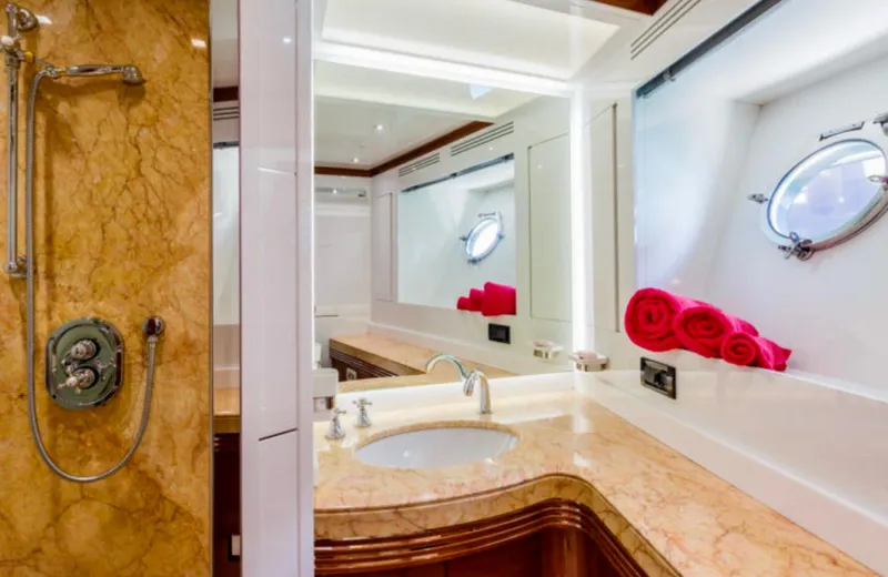 Lady Mura Yacht Photos Pics Luxurious bathroom in 2010 Dominator 29M yacht with marble surfaces and elegant fixtures.