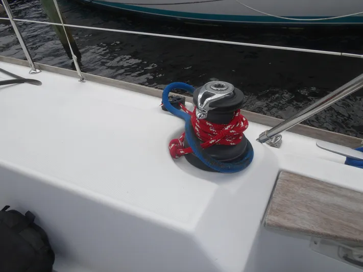 Magic Carpet Yacht Photos Pics Winch with red and blue ropes on Jeanneau Sun Odyssey 36i sailboat, 2010 model.