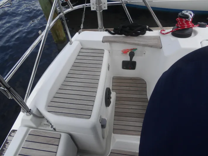 Magic Carpet Yacht Photos Pics Cockpit of 2010 Jeanneau Sun Odyssey 36i sailboat with teak seating and winch.