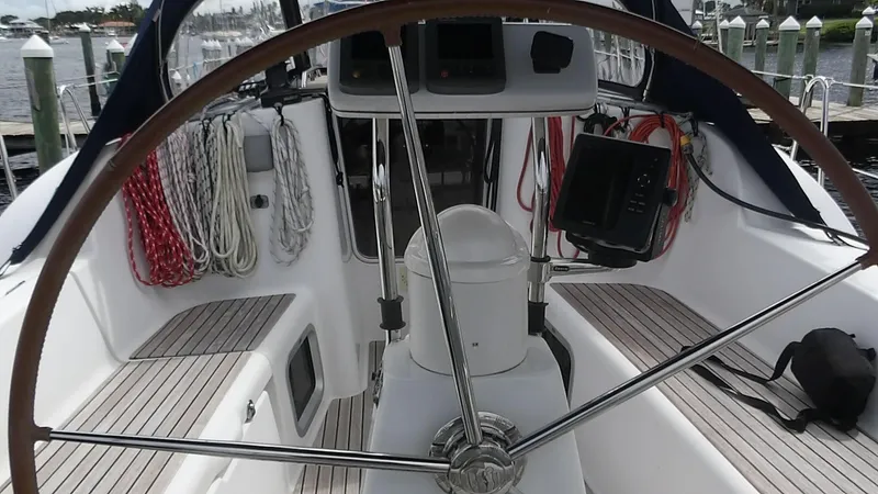 Magic Carpet Yacht Photos Pics 2010 Jeanneau Sun Odyssey 36i cockpit with steering wheel and navigation equipment.