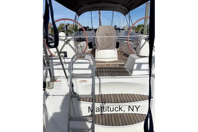 Rising Sun Yacht Photos Pics 2016 Jeanneau Sun Odyssey 50 DS sailboat deck in Mattituck, NY, featuring dual steering wheels.