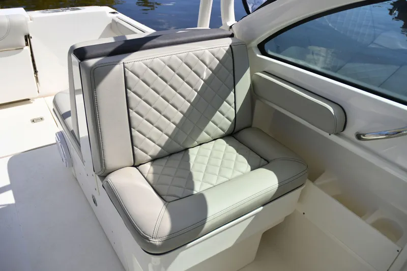  Yacht Photos Pics 2024 Pursuit DC 246 Dual Console boat seat with quilted upholstery.