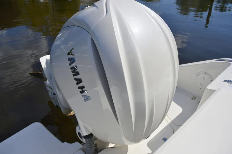  Yacht Photos Pics 2024 Pursuit DC 246 Dual Console with Yamaha outboard engine on water.