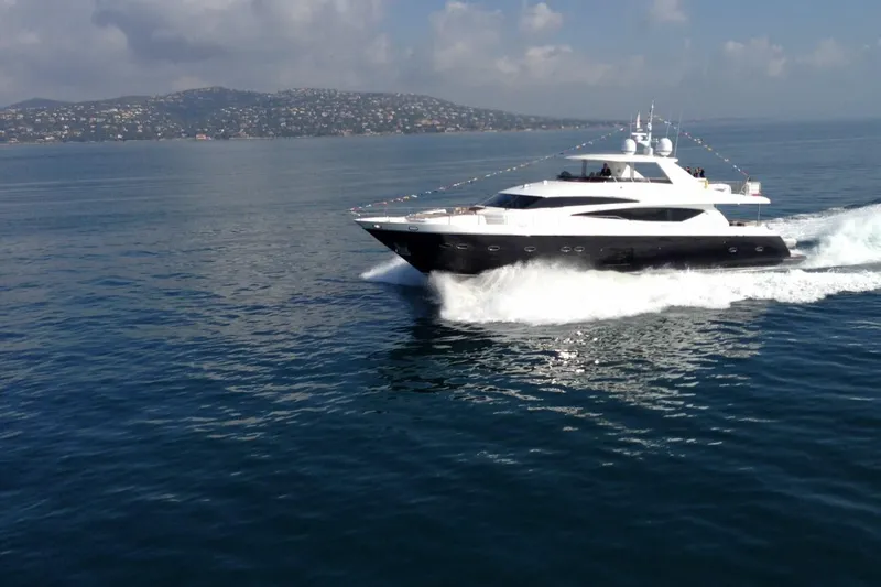 Mira Yacht Photos Pics 2013 Princess 98 Motor Yacht cruising on open water with scenic coastline backdrop.