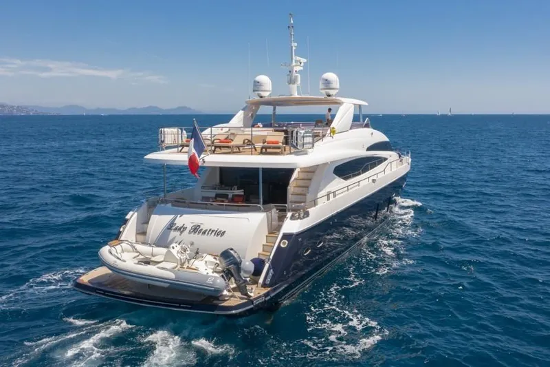 Mira Yacht Photos Pics Luxurious 2013 Princess 98 Motor Yacht cruising on open sea under clear skies.