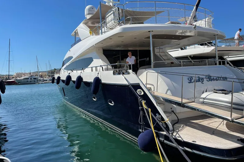 Mira Yacht Photos Pics 2013 Princess 98 Motor Yacht docked in a sunny marina, featuring sleek design and luxury amenities.