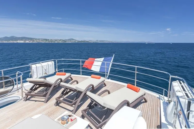 Mira Yacht Photos Pics Luxurious 2013 Princess 98 Motor Yacht deck with sun loungers and ocean view.