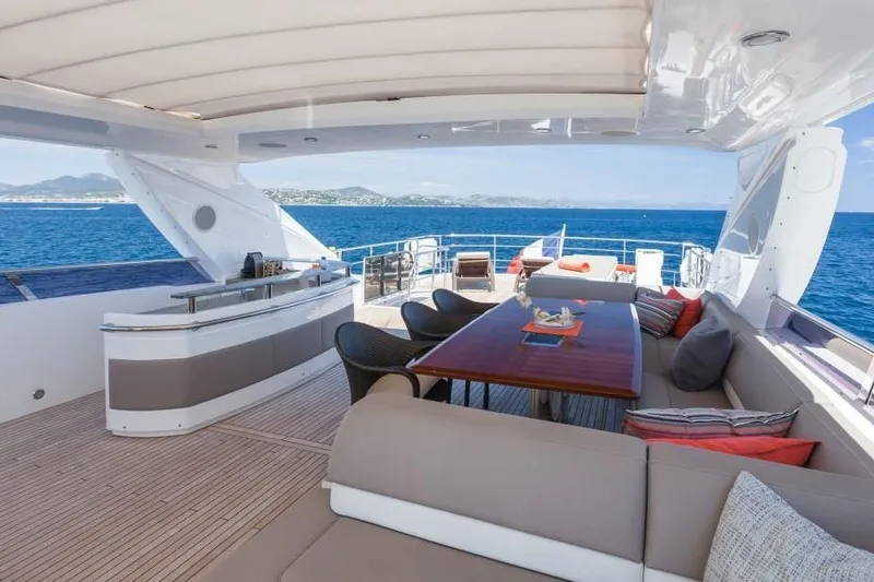 Mira Yacht Photos Pics Luxurious 2013 Princess 98 Motor Yacht deck with seating, bar, and ocean view.