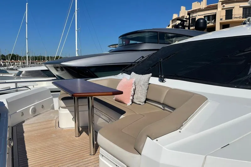 Mira Yacht Photos Pics Luxurious 2013 Princess 98 Motor Yacht with elegant outdoor seating and table.