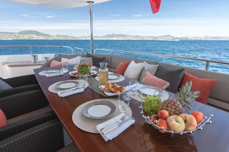 Mira Yacht Photos Pics Luxurious dining setup on 2013 Princess 98 Motor Yacht with ocean view.