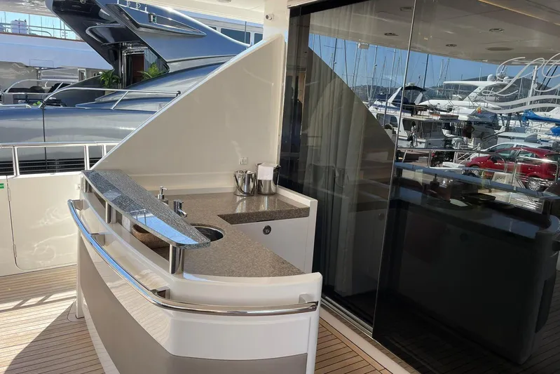 Mira Yacht Photos Pics Luxurious 2013 Princess 98 Motor Yacht with sleek outdoor bar area and modern design.