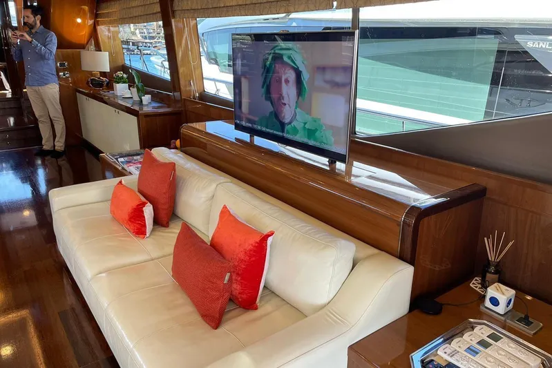 Mira Yacht Photos Pics Luxurious interior of 2013 Princess 98 Motor Yacht with modern decor and entertainment system.