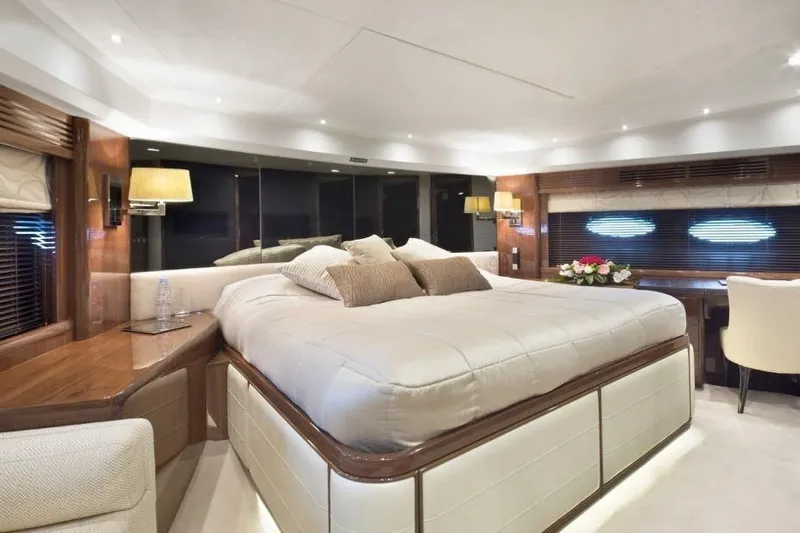 Mira Yacht Photos Pics Luxurious bedroom interior of 2013 Princess 98 Motor Yacht with elegant furnishings.