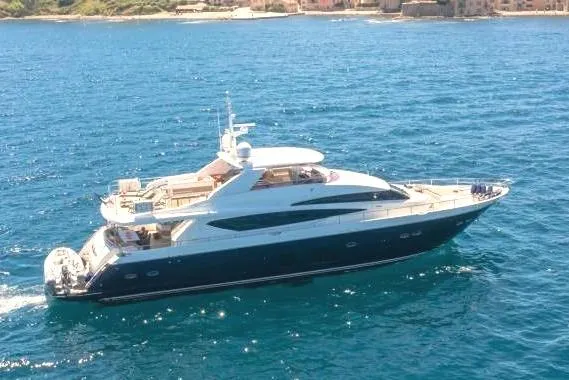 Mira Yacht Photos Pics 2013 Princess 98 Motor Yacht cruising near scenic coastal town.