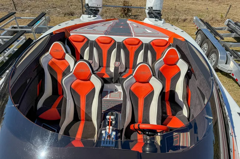  Yacht Photos Pics 2021 MTI 390X boat interior with vibrant red and black seating arrangement.