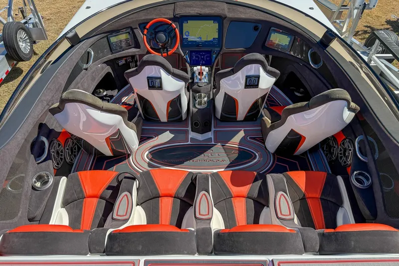  Yacht Photos Pics Luxurious 2021 MTI 390X boat interior with red and black seating, advanced navigation, and sleek design.