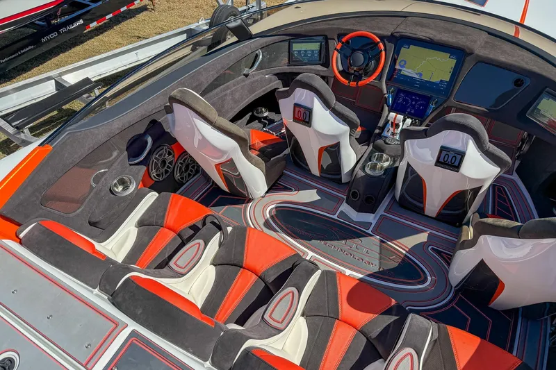  Yacht Photos Pics Interior of a 2021 MTI 390X boat with modern seating and advanced navigation system.