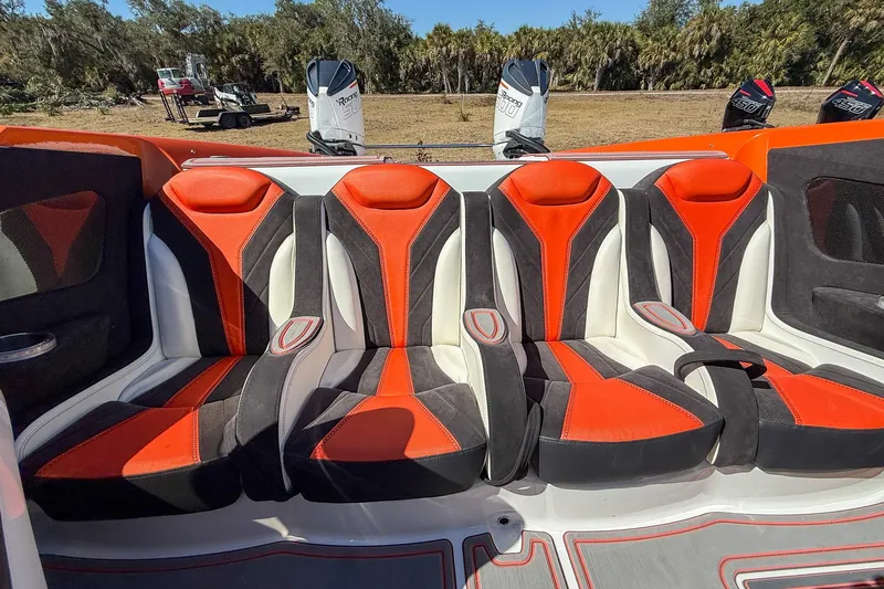  Yacht Photos Pics Luxury MTI 390X 2021 boat interior with vibrant orange and black seating.