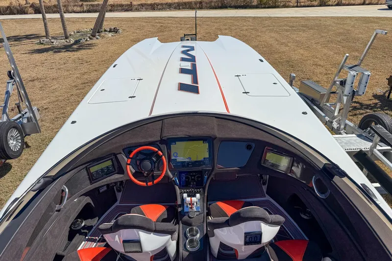  Yacht Photos Pics Cockpit view of 2021 MTI 390X boat with advanced navigation system and sporty design.