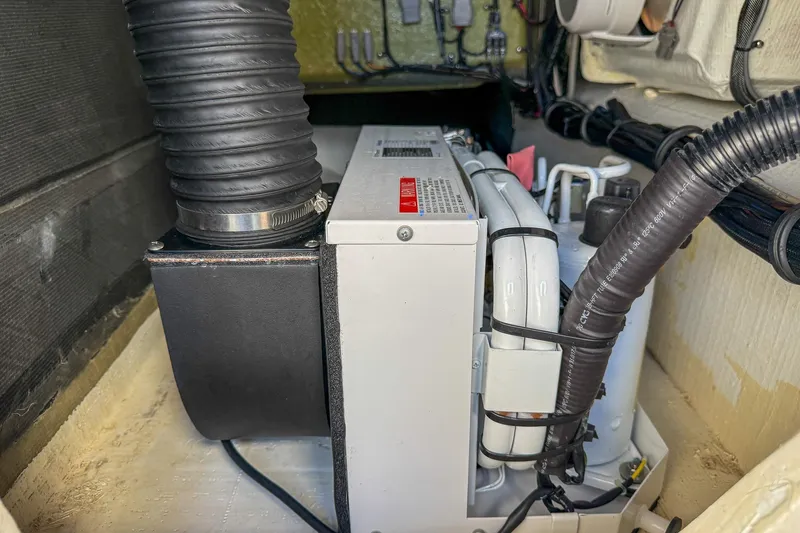  Yacht Photos Pics Engine compartment of 2021 MTI 390X with visible hoses and components.