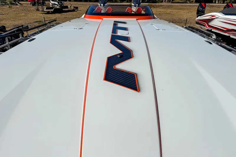  Yacht Photos Pics 2021 MTI 390X boat with sleek design and bold graphics on deck.