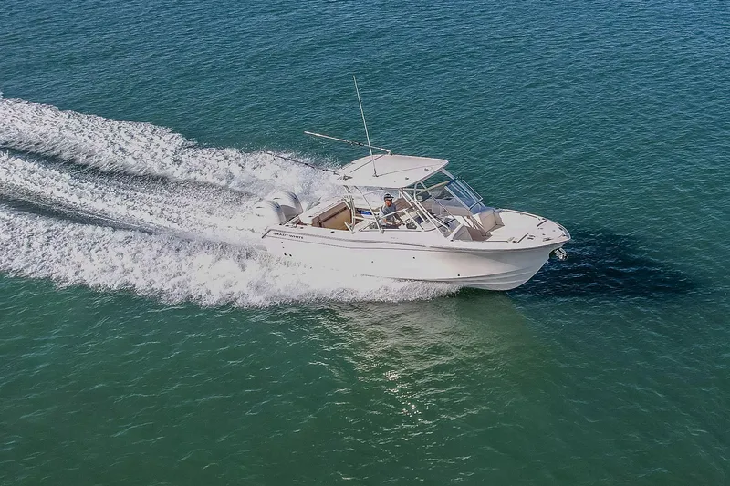 Fin & Tonic Yacht Photos Pics 2024 Grady-White Freedom 275 boat cruising on open water.