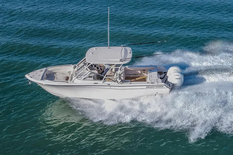 Fin & Tonic Yacht Photos Pics 2024 Grady-White Freedom 275 boat cruising on open water, showcasing speed and design.