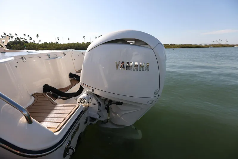 Fin & Tonic Yacht Photos Pics 2024 Grady-White Freedom 275 boat with Yamaha outboard engine on calm water.