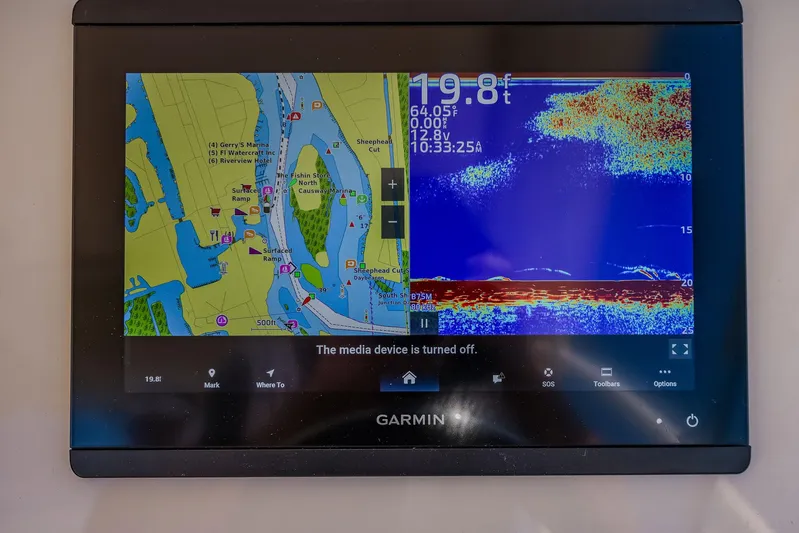 Fin & Tonic Yacht Photos Pics Garmin marine navigation display on 2024 Grady-White Freedom 275 boat, showing map and sonar.