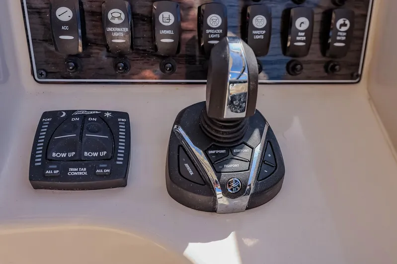 Fin & Tonic Yacht Photos Pics Control panel of 2024 Grady-White Freedom 275 boat with joystick and switches.