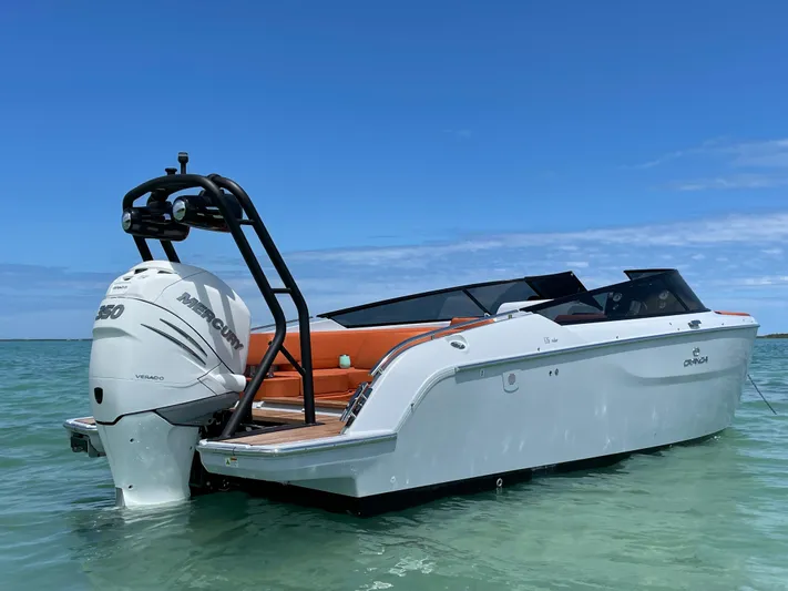 #0063 Bianca Panarea Yacht Photos Pics 2022 Cranchi 26 Rider boat on clear water under blue sky.