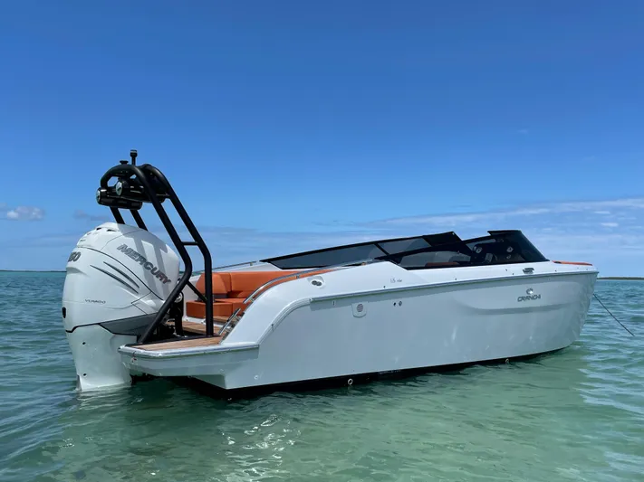 #0063 Bianca Panarea Yacht Photos Pics 2022 Cranchi 26 Rider boat on clear water under blue sky.