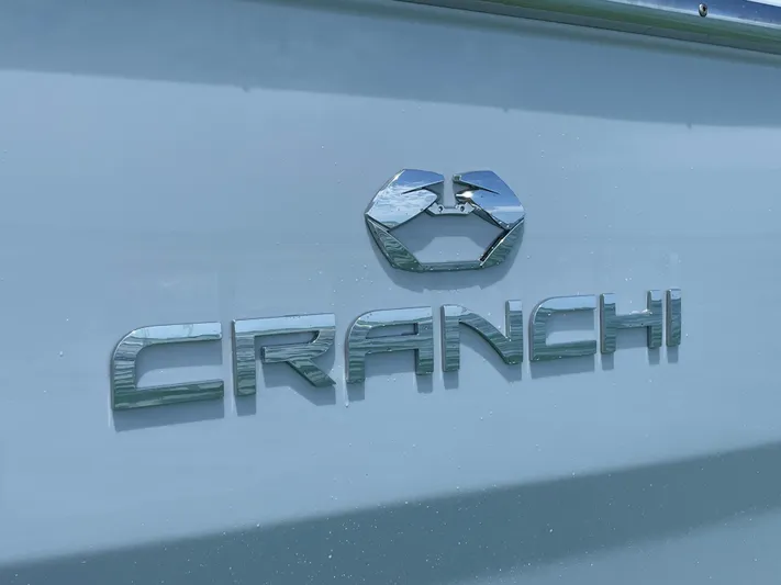 #0063 Bianca Panarea Yacht Photos Pics Cranchi 26 Rider 2022 logo on boat exterior, metallic finish.