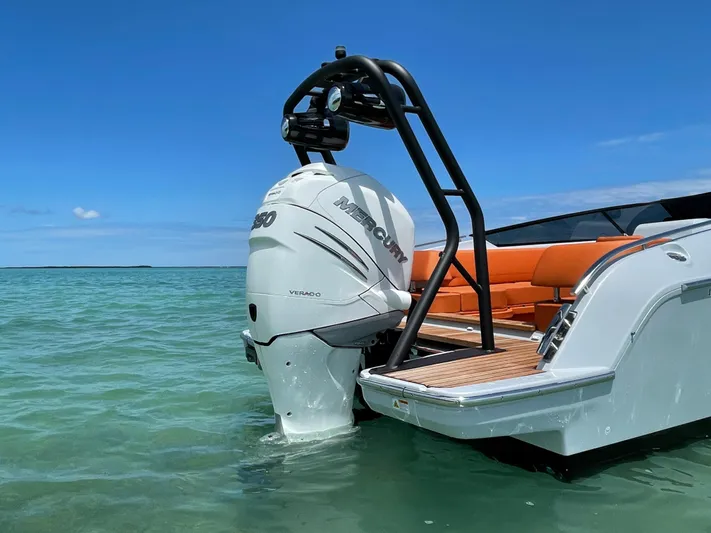 #0063 Bianca Panarea Yacht Photos Pics 2022 Cranchi 26 Rider boat with Mercury engine in clear blue water.
