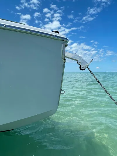 #0063 Bianca Panarea Yacht Photos Pics 2022 Cranchi 26 Rider boat anchored in clear turquoise water under a blue sky.