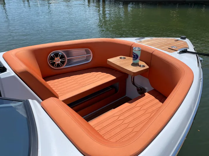 #0063 Bianca Panarea Yacht Photos Pics 2022 Cranchi 26 Rider boat with orange seating and a drink holder on a sunny day.