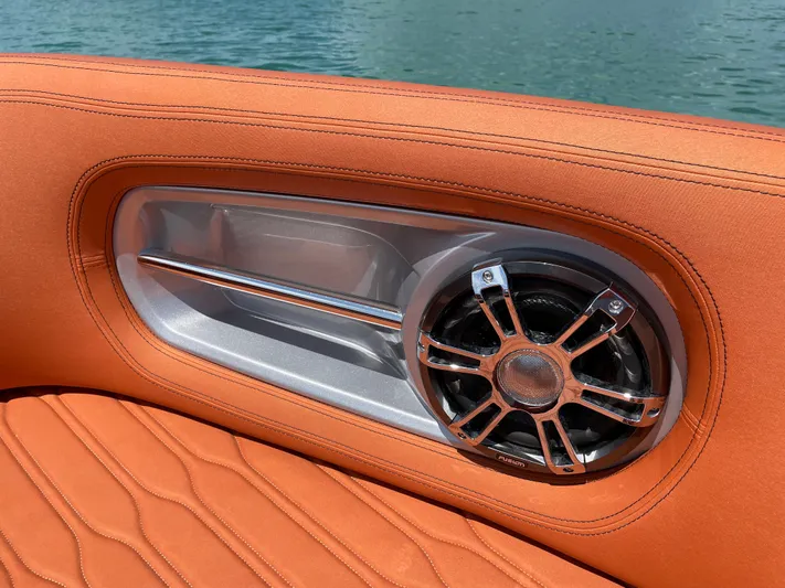 #0063 Bianca Panarea Yacht Photos Pics Orange interior of 2022 Cranchi 26 Rider boat with speaker detail.