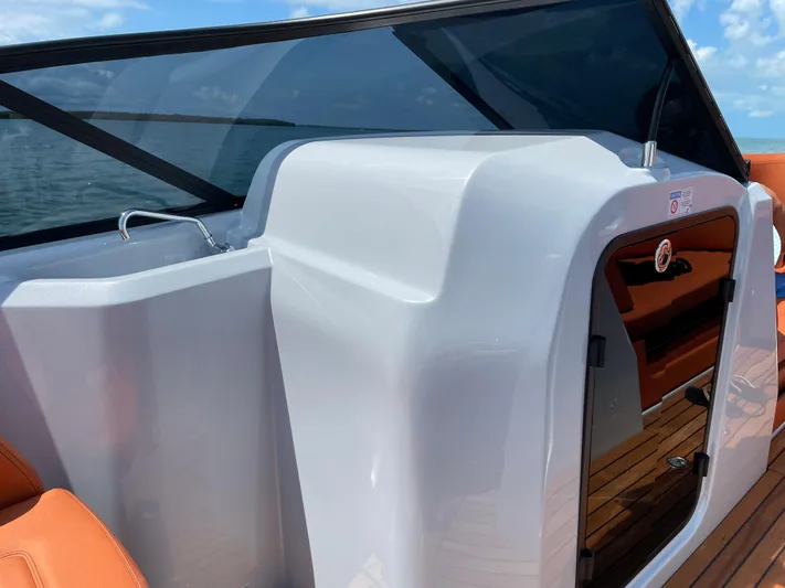 #0063 Bianca Panarea Yacht Photos Pics 2022 Cranchi 26 Rider boat interior with sleek design and modern features.