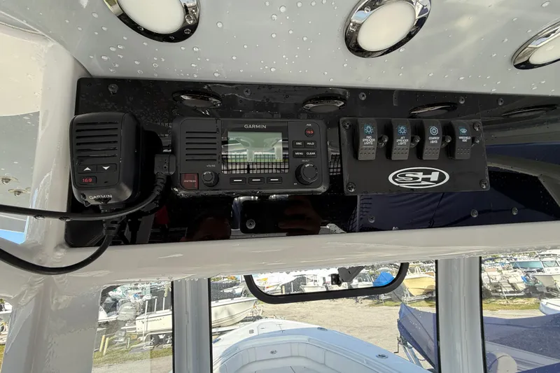  Yacht Photos Pics Control panel of 2021 Sea Hunt Ultra 305 SE with Garmin electronics and switches.