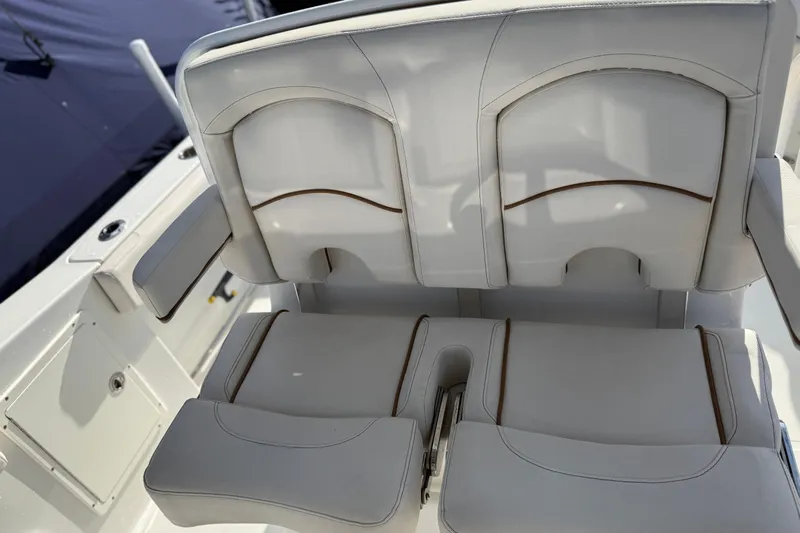  Yacht Photos Pics Luxury seating on 2021 Sea Hunt Ultra 305 SE boat, featuring white upholstery and armrests.