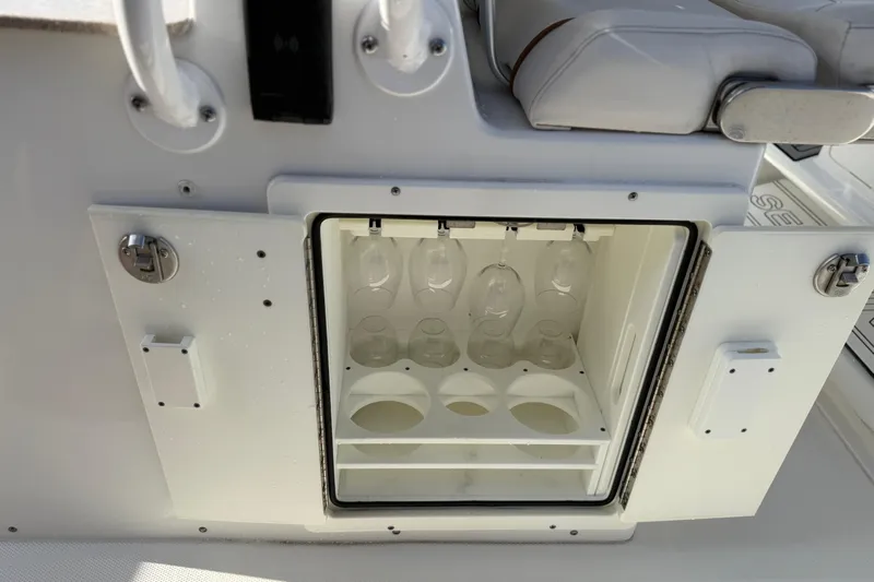  Yacht Photos Pics 2021 Sea Hunt Ultra 305 SE boat with built-in glass storage compartment.