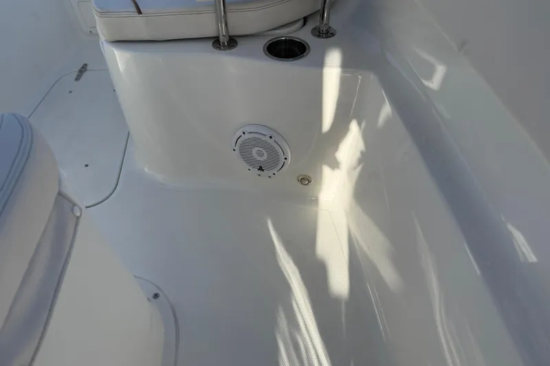  Yacht Photos Pics 2021 Sea Hunt Ultra 305 SE boat interior with speaker and seating area.