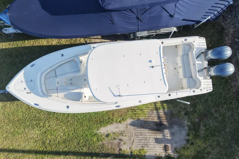  Yacht Photos Pics Aerial view of a 2021 Sea Hunt Ultra 305 SE boat on grass.