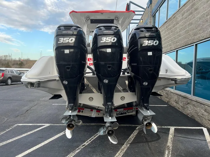 Perseverance Yacht Photos Pics 2019 Fountain 39 NX boat with triple 350 horsepower engines, parked outdoors.