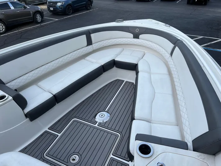 Perseverance Yacht Photos Pics 2019 Fountain 39 NX boat with spacious white and gray seating in a parking lot.