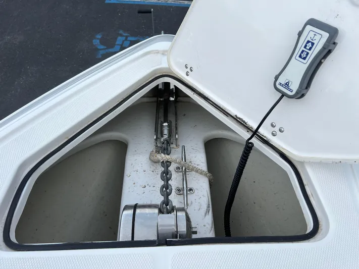 Perseverance Yacht Photos Pics Anchor compartment of a 2019 Fountain 39 NX boat with chain and control panel.