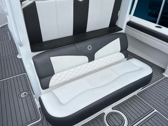 Perseverance Yacht Photos Pics Luxury seating on 2019 Fountain 39 NX boat with stylish black and white upholstery.