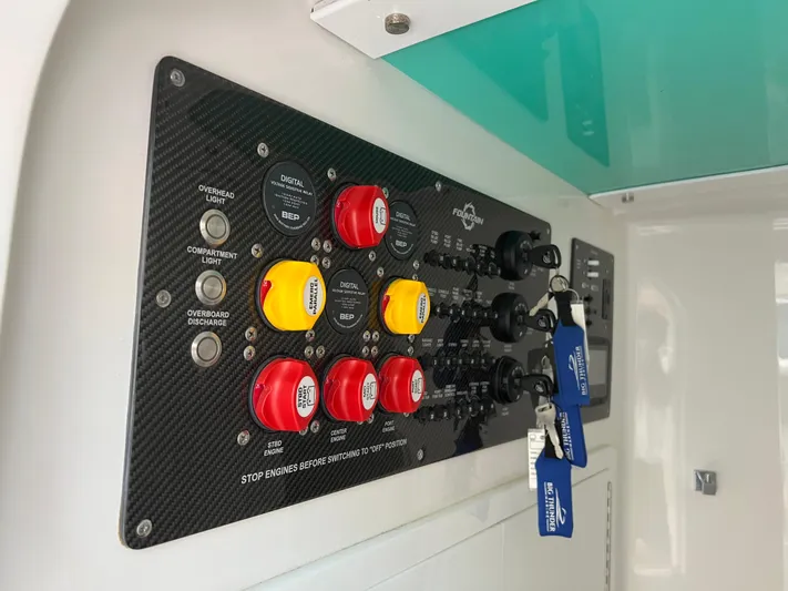 Perseverance Yacht Photos Pics Control panel of a 2019 Fountain 39 NX boat with labeled switches and keys.